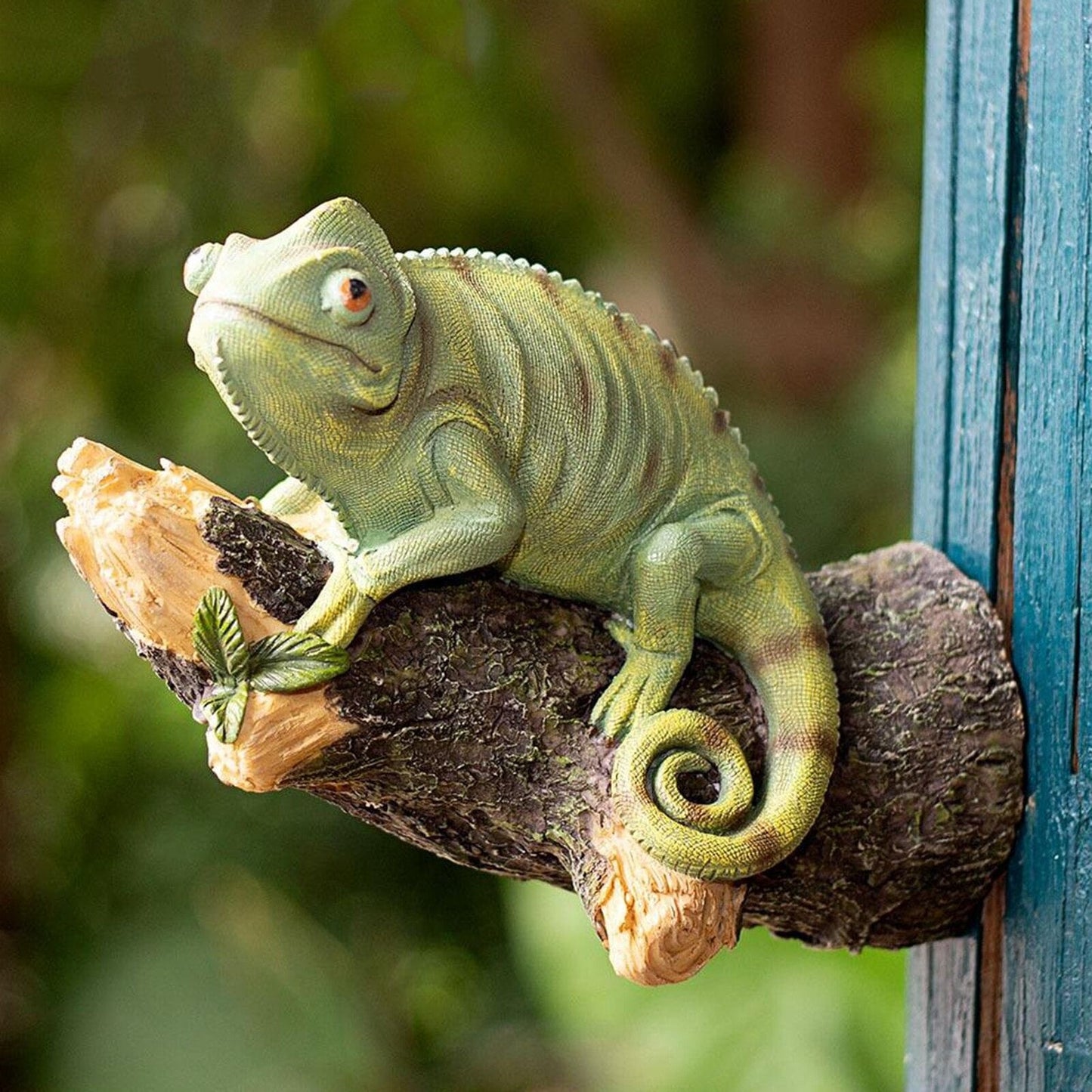 Resin chameleon figurine on the tree